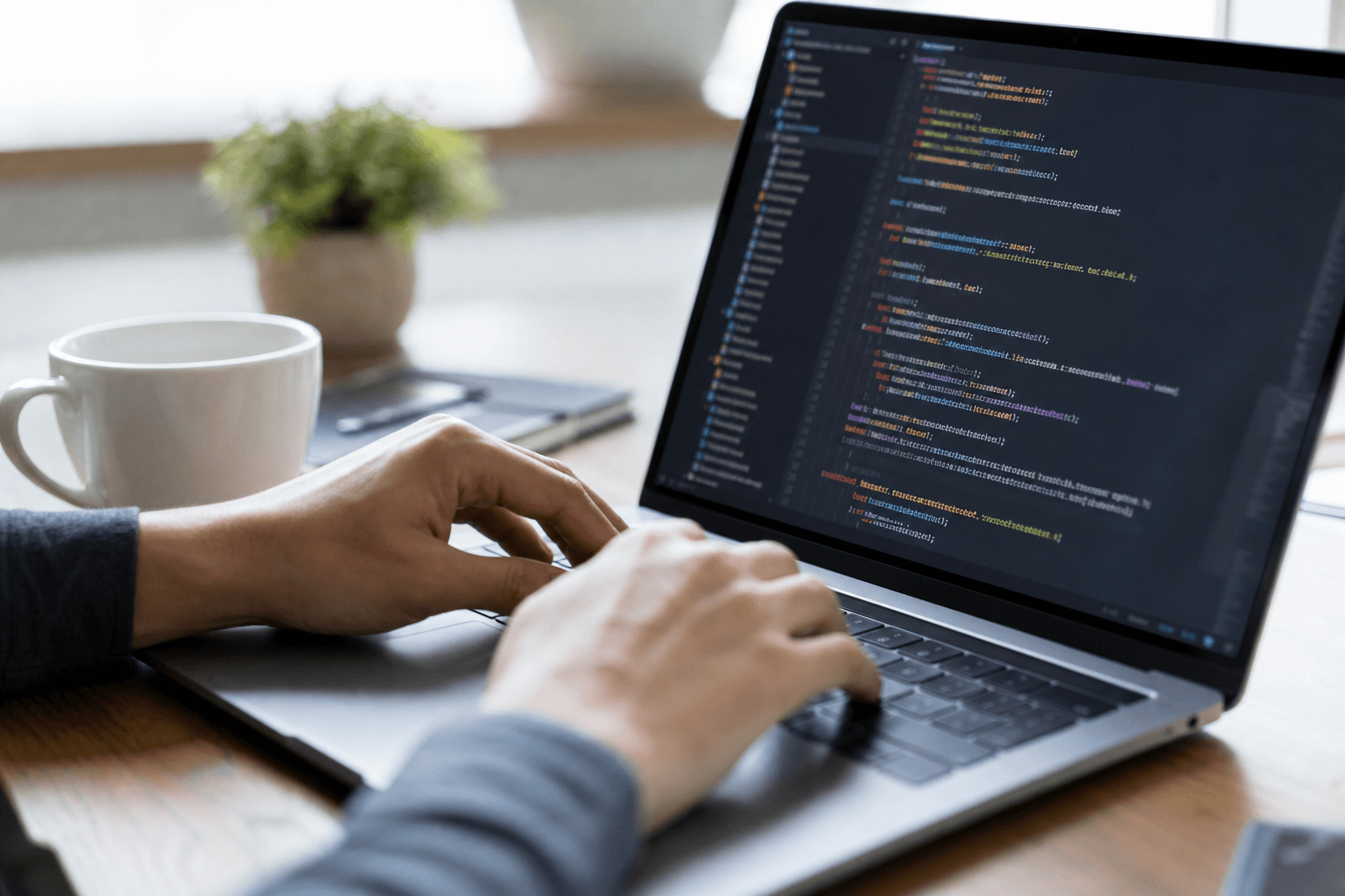 Developer writing integration code on a laptop
